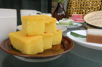 Stack of yellow blocks on a brown plate with a blurred background