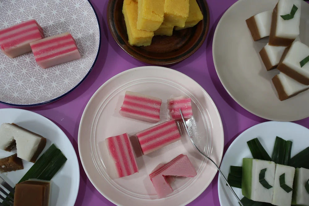 Close-up of Kuih Lapis showing soft colourful rose milk and white layers