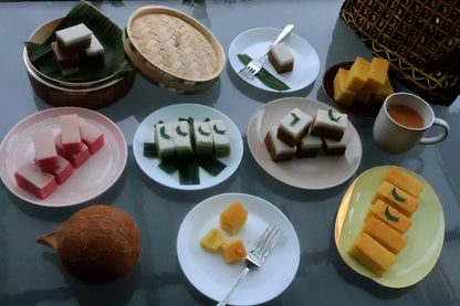 Assorted traditional desserts on plates and a table.